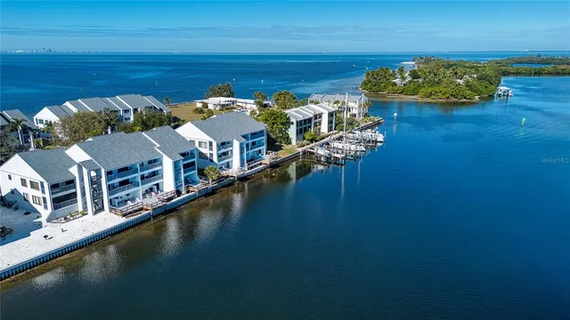 an aerial view of a house with a lake view