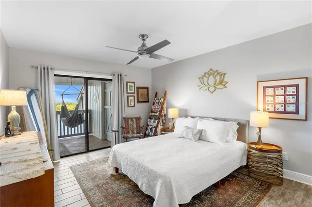 a bed room with a bed and a mirror