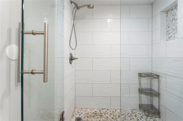 a bathroom with a granite countertop sink toilet and a mirror