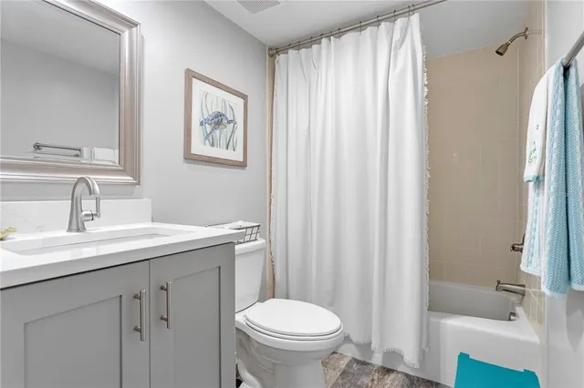 a view of a livingroom with workspace and a couch