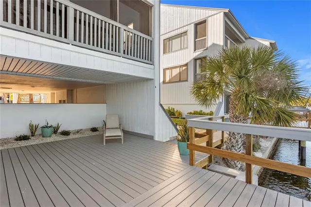 a view of roof deck with a lake view