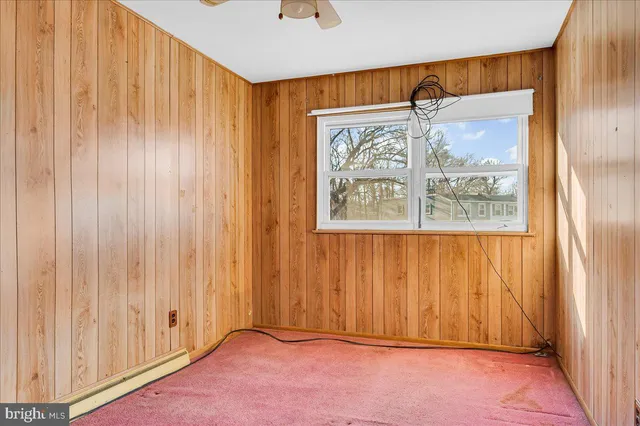a view of an entryway with a wooden door
