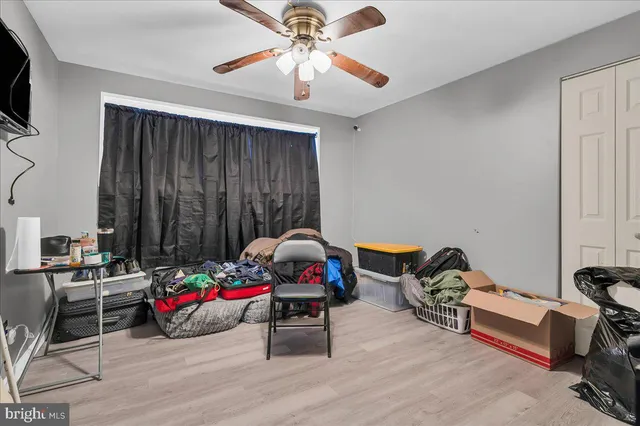 a bedroom with bed and a chandelier