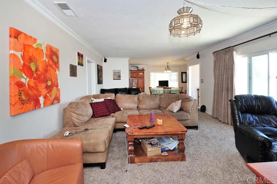 2839 Helix Street Spring Valley, CA 91977 - Photo 5 of 13 Looking across living room to dining area and kitchen.