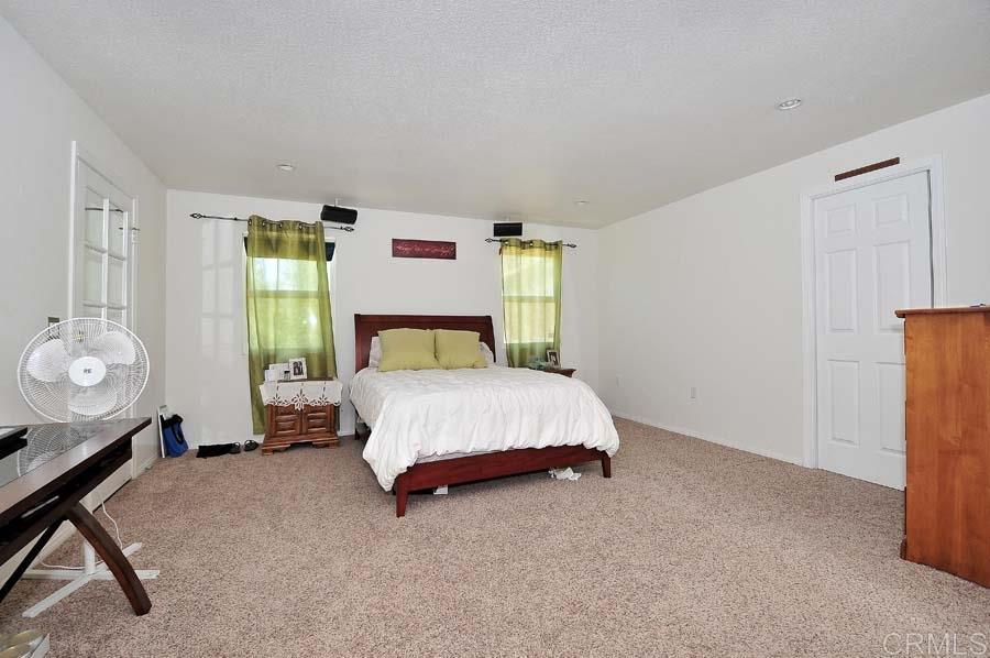 2839 Helix Street Spring Valley, CA 91977 - Photo 10 of 13 Large master suite has a walk-out balcony and a large closet. Located on the far end of house for privacy.