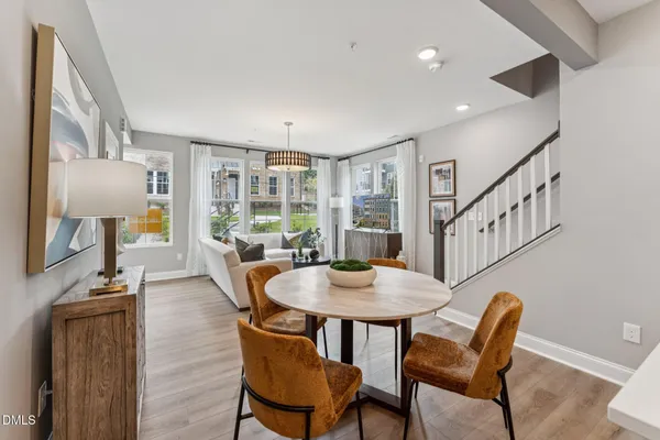 a view of a dining room with furniture window and wooden floor