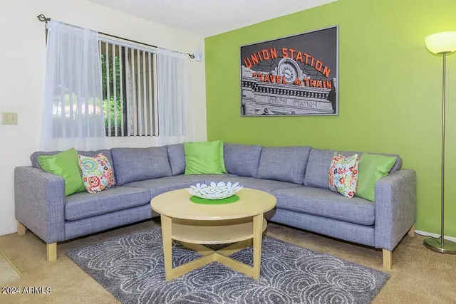 a living room with furniture and a window