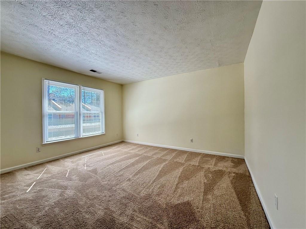 3533 Mulberry Way Duluth, GA 30096 - Photo 21 of 29 an empty room with a window