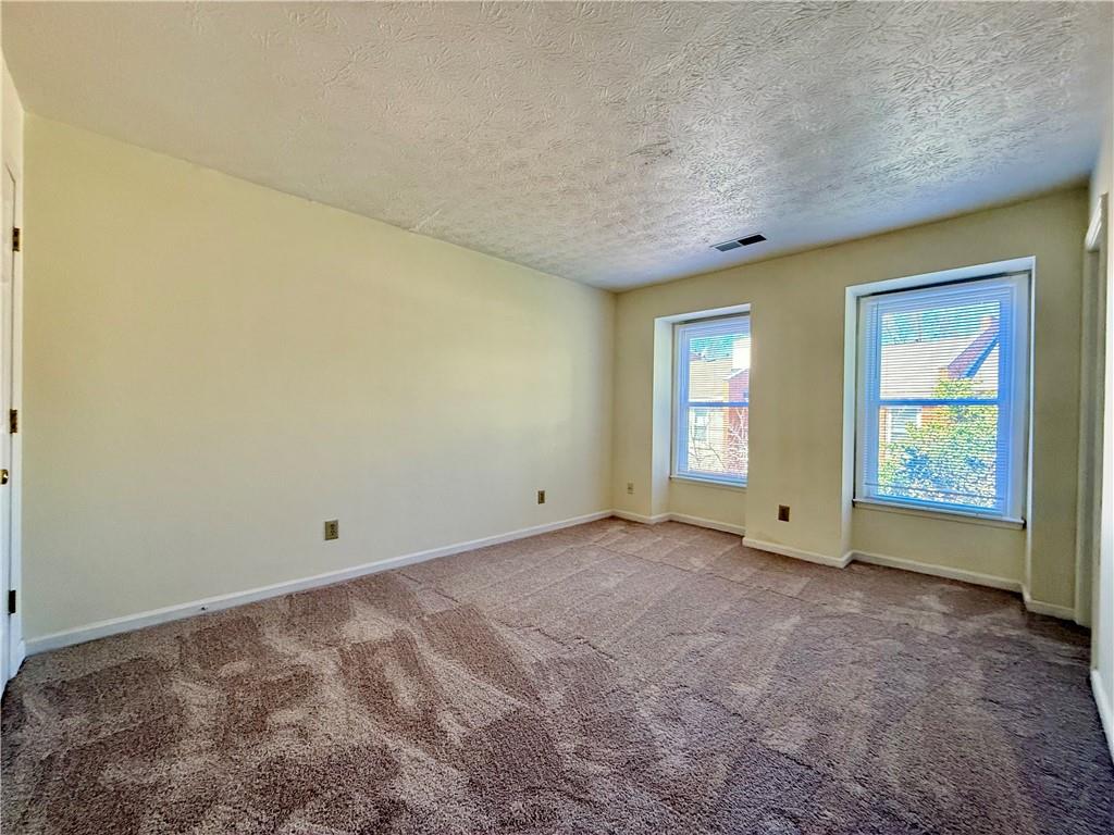 3533 Mulberry Way Duluth, GA 30096 - Photo 22 of 29 a view of an empty room with a window