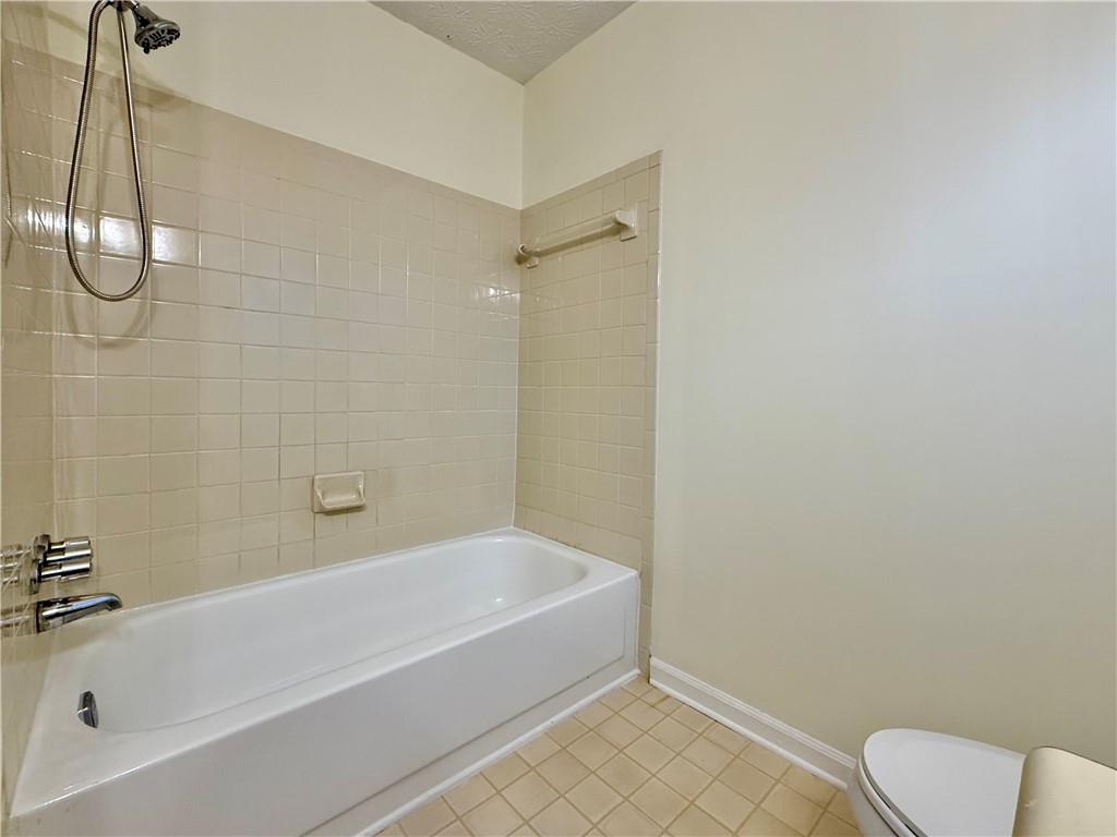 3533 Mulberry Way Duluth, GA 30096 - Photo 24 of 29 a white bath tub sitting next to a toilet