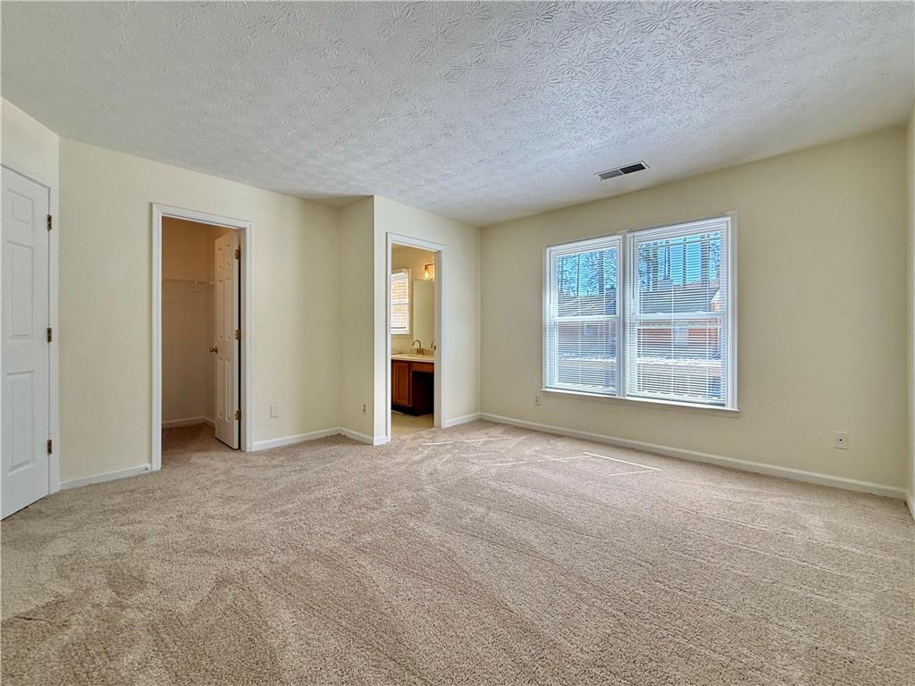 3533 Mulberry Way Duluth, GA 30096 - Photo 26 of 29 an empty room with windows