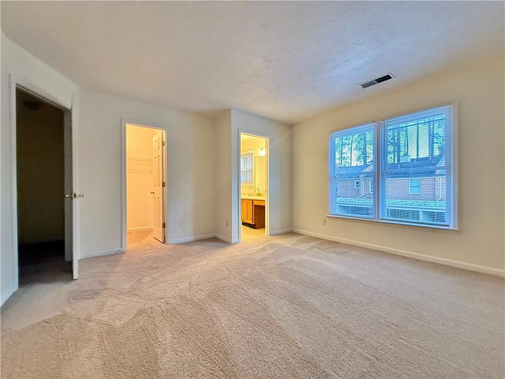 3533 Mulberry Way Duluth, GA 30096 - Photo 29 of 29 an empty room with windows and closet
