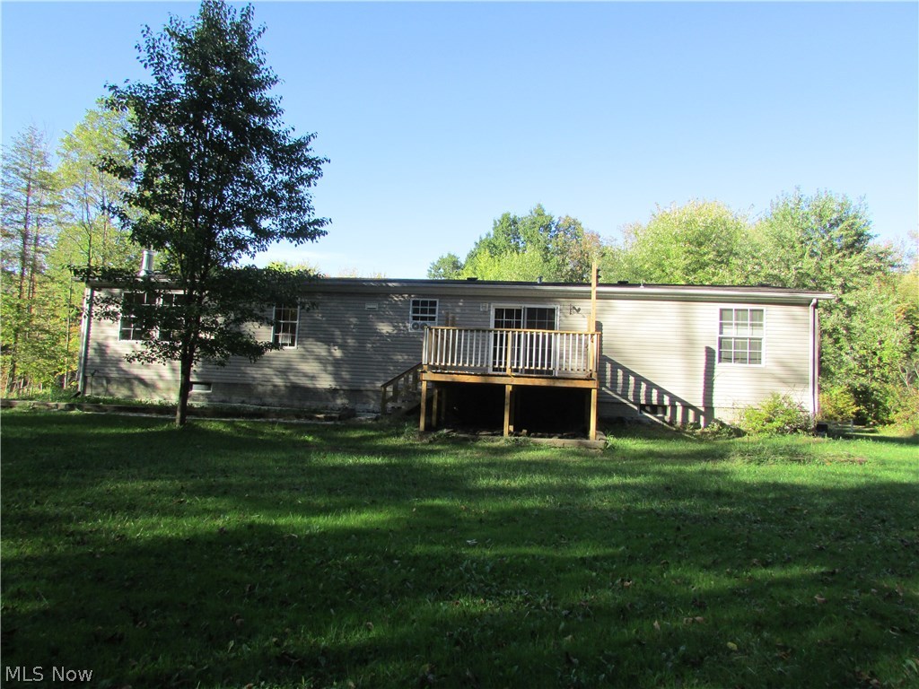 1220 Way Road Rome, OH 44085 - Photo 4 of 25 The back of the home is visible here. This back deck was also recently added.