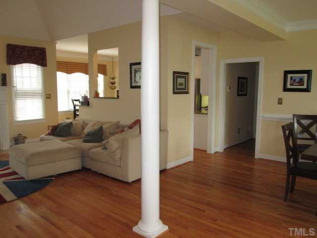8120 Standing Stone Court Raleigh, NC 27613 - Photo 25 of 25 This view of the interior space shows some of the layout. Nice and open floor plan, with living room to the left in this photo and dining room to the right. Hardwood flooring, crown moldings, chair rail moldings in dining space! View