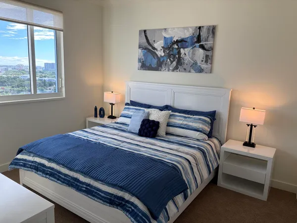 a bedroom with bed and window