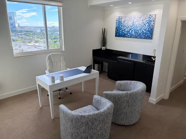 a living room with furniture and a window