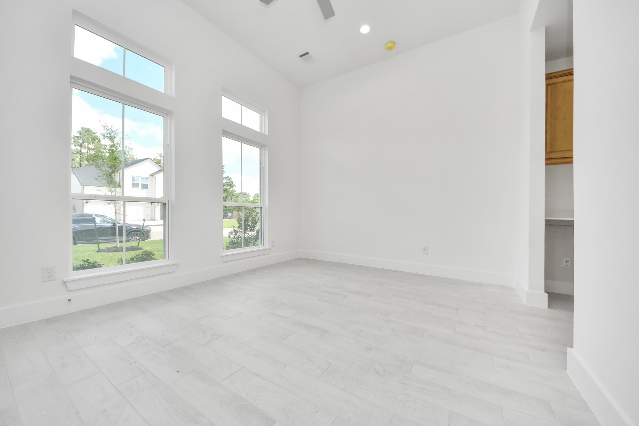 3038 Native Spg Drive Spring, TX 77373 - Photo 8 of 44 Step into the inviting home office, where elegant tile flooring adds a touch of freshness and comfort to the workspace. Natural light pours through the window, creating an inspiring environment for productivity and focus.
