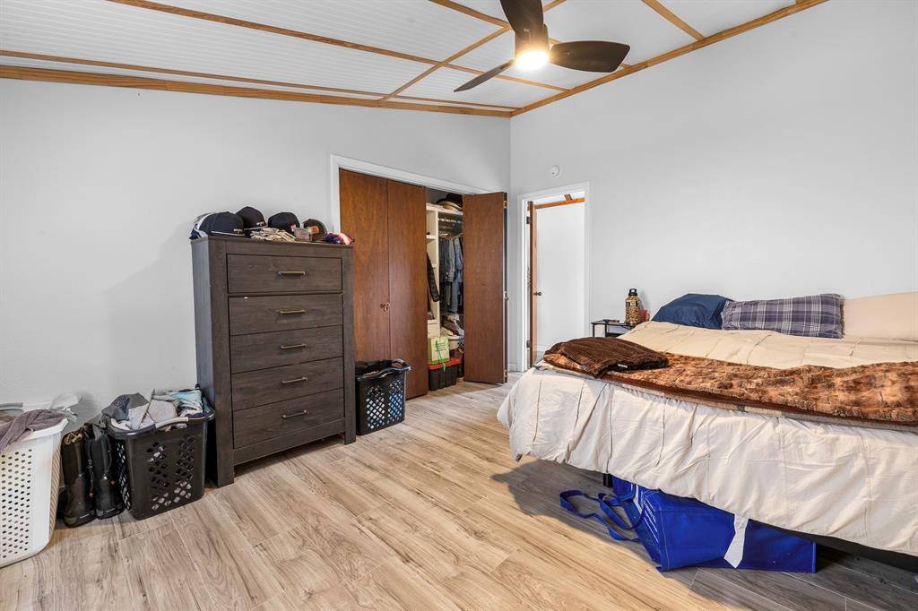 505 Alexander Road Stephenville, TX 76401 - Photo 11 of 29 a bedroom with a bed and a closet