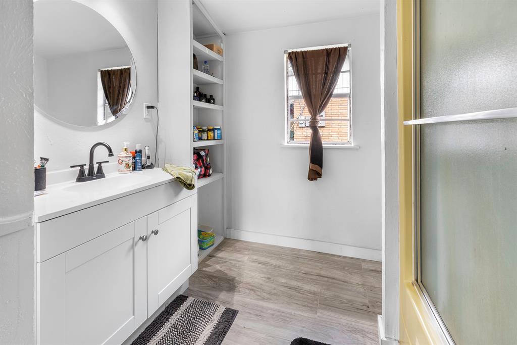 505 Alexander Road Stephenville, TX 76401 - Photo 13 of 29 a bathroom with a sink and a mirror