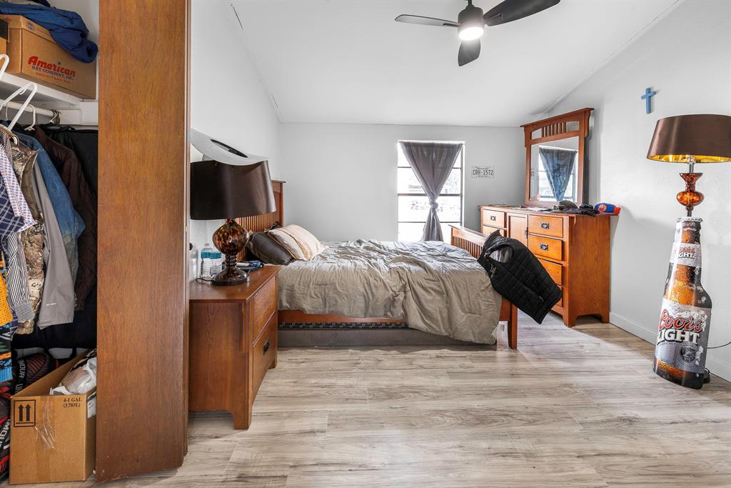 505 Alexander Road Stephenville, TX 76401 - Photo 15 of 29 a bed room with a bed and a tv