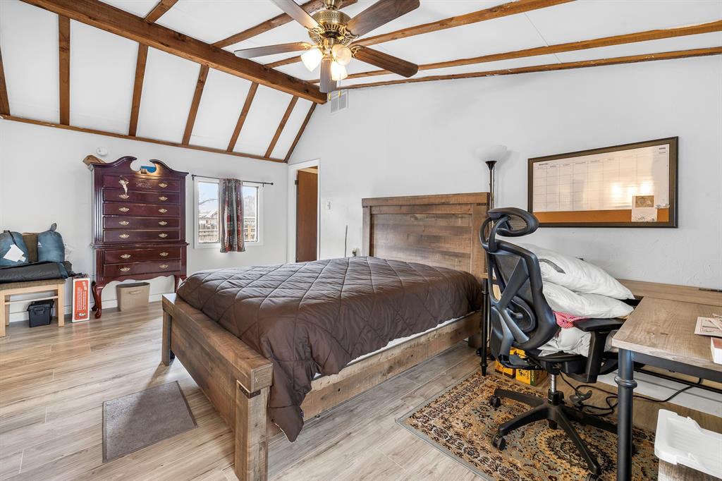 505 Alexander Road Stephenville, TX 76401 - Photo 17 of 29 a bedroom with a bed and a table