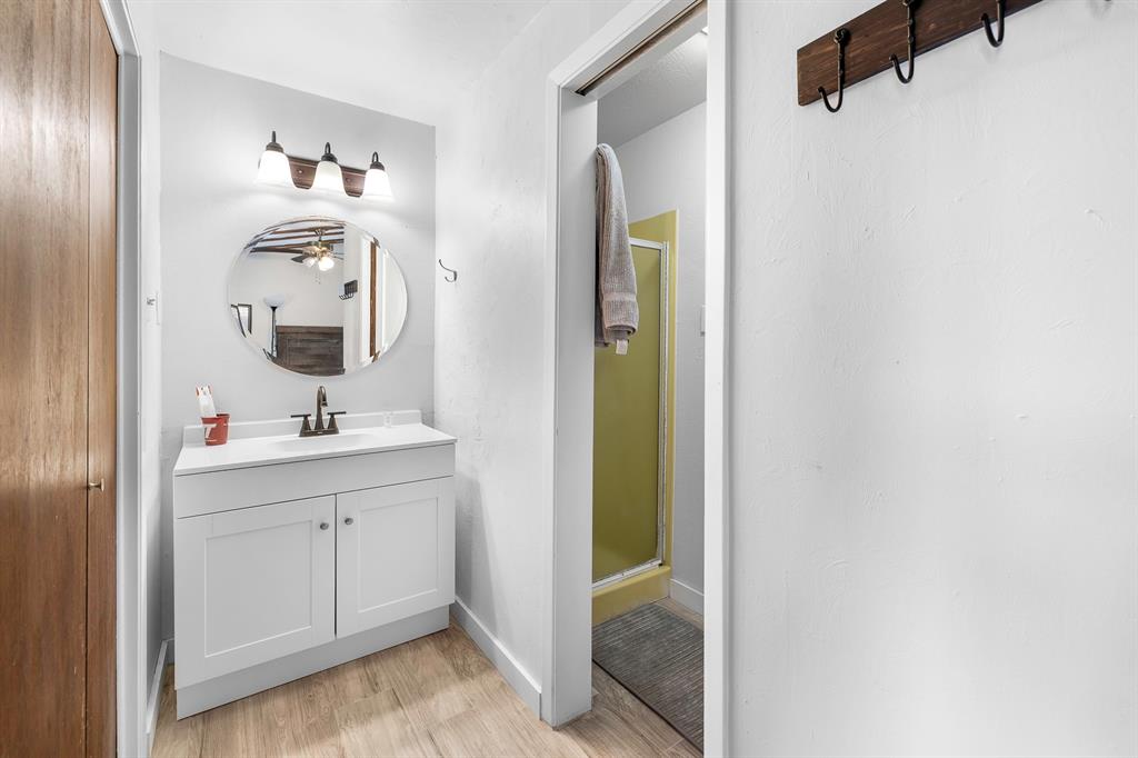 505 Alexander Road Stephenville, TX 76401 - Photo 18 of 29 a bathroom with a sink and a mirror