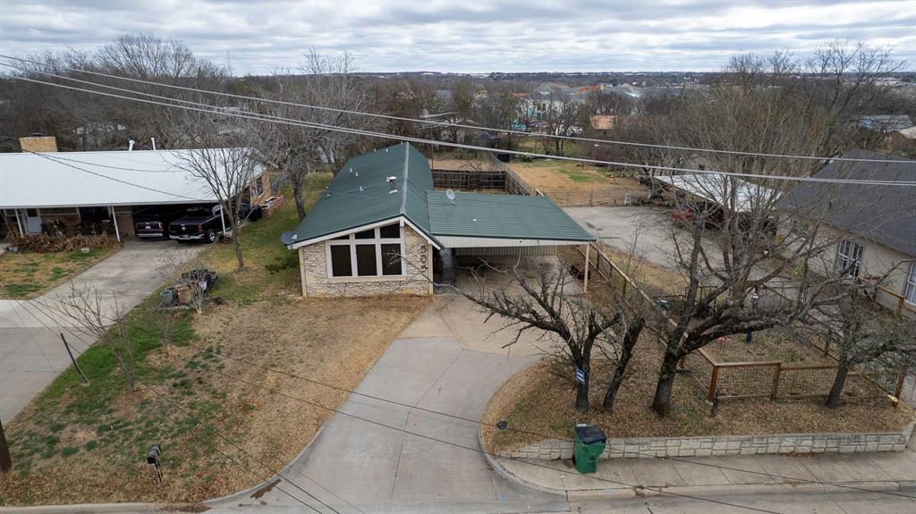 505 Alexander Road Stephenville, TX 76401 - Photo 27 of 29 a view of a house with a yard