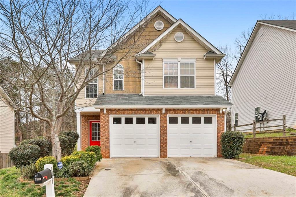 3855 Riverside Parkway Decatur, GA 30034 - Photo 1 of 1 a front view of a house with a garden