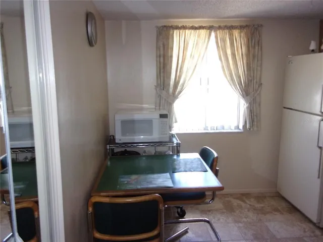 a kitchen with stainless steel appliances granite countertop a refrigerator stove and sink