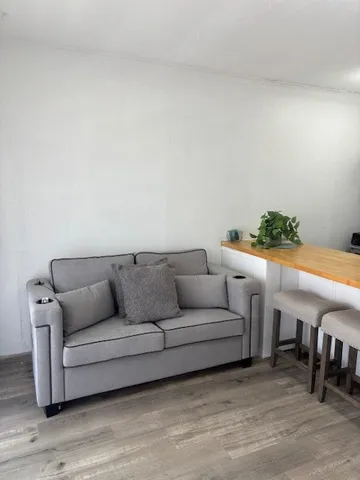 a kitchen with stainless steel appliances a sink a stove a microwave and cabinets