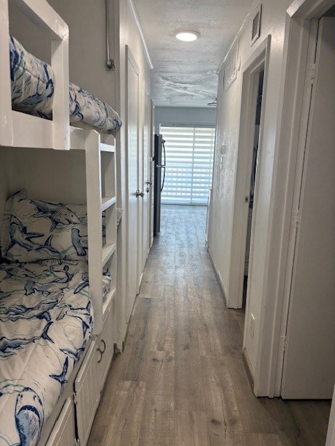 3938 Surfside Boulevard, Unit 2106 Corpus Christi, TX 78402 - Photo 9 of 21 a view of a hallway with wooden floor
