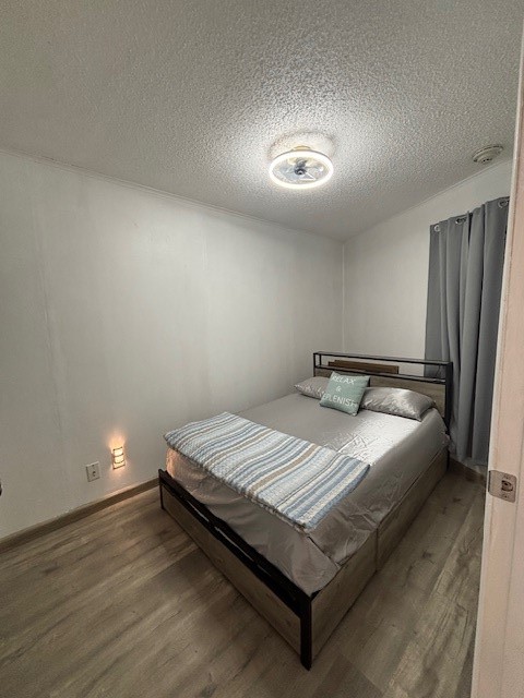 3938 Surfside Boulevard, Unit 2106 Corpus Christi, TX 78402 - Photo 10 of 21 a bed sitting in a bedroom next to a cabinet