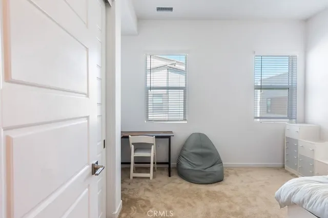 a bedroom with a bed and a cabinets