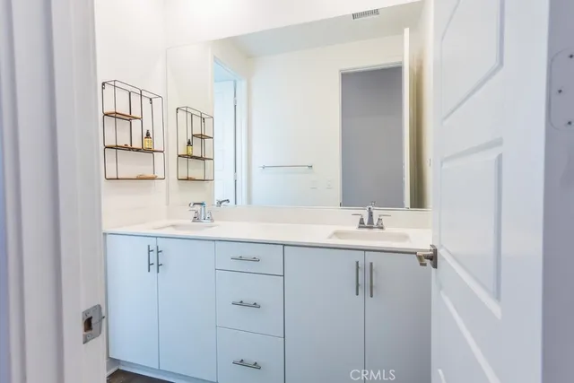 a bathroom with a sink and mirror
