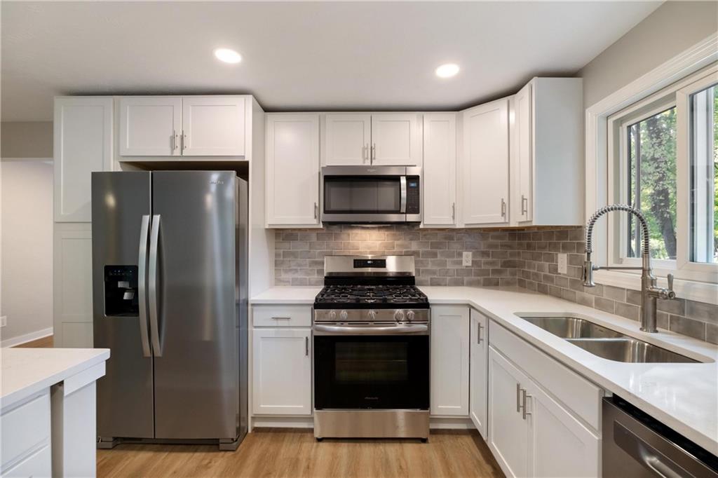 4786 Doyle Road Pittsburgh, PA 15227 - Photo 11 of 31 a kitchen with a sink stove and refrigerator