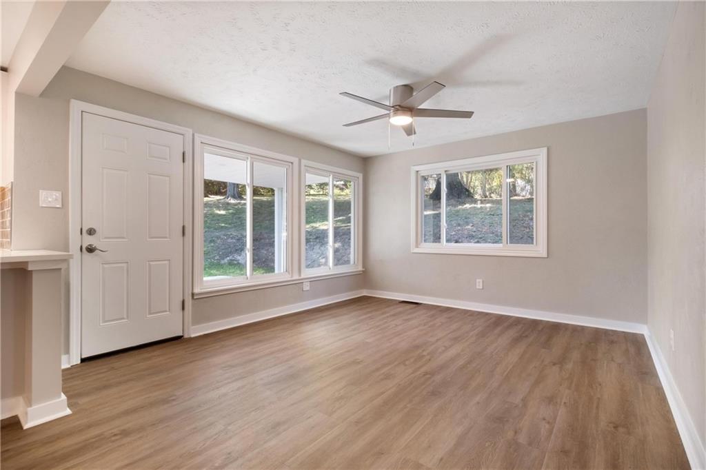 4786 Doyle Road Pittsburgh, PA 15227 - Photo 12 of 31 a view of an empty room with a window and wooden floor