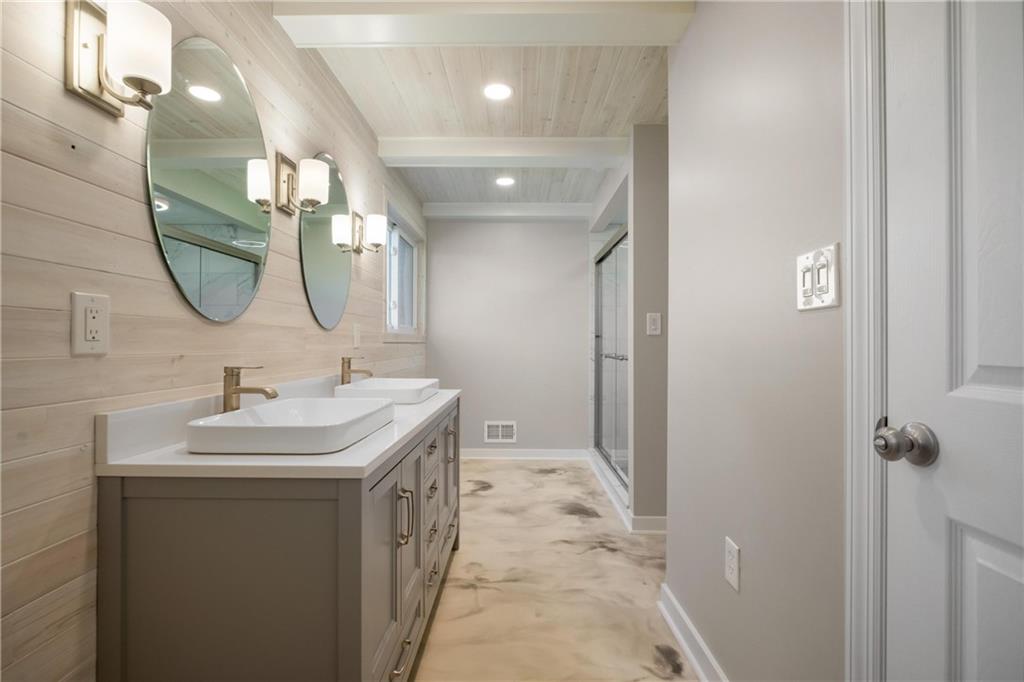 4786 Doyle Road Pittsburgh, PA 15227 - Photo 17 of 31 a bathroom with a sink a light fixture and a mirror