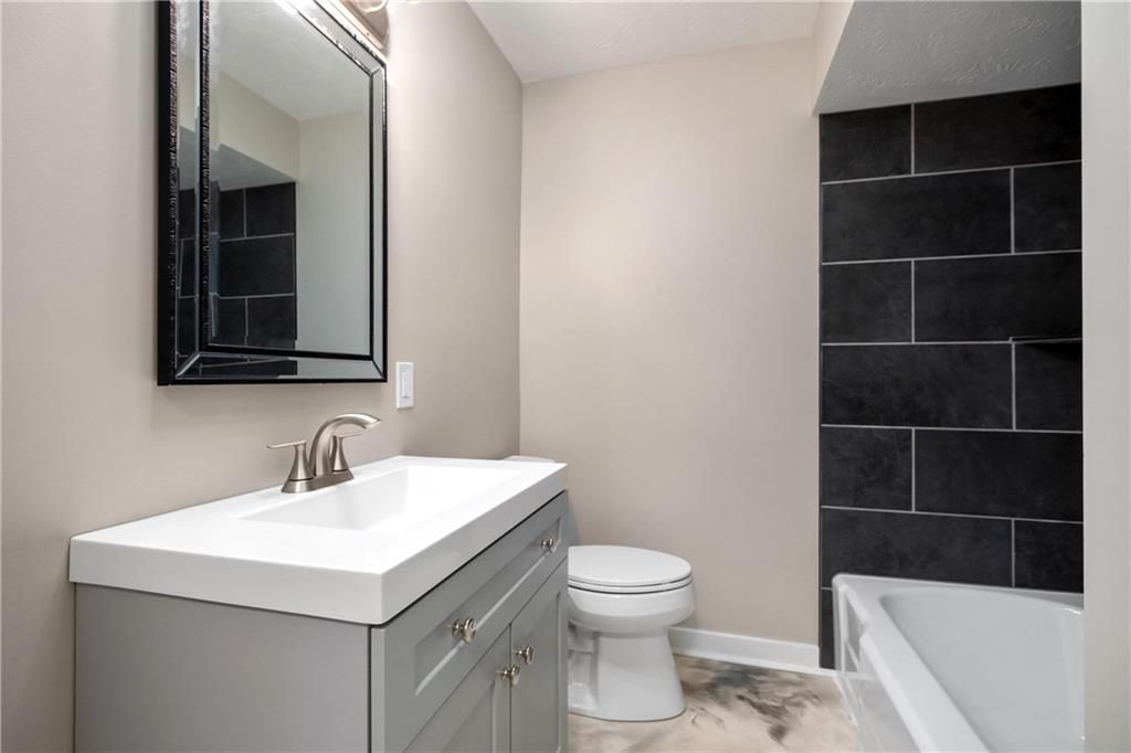 4786 Doyle Road Pittsburgh, PA 15227 - Photo 21 of 31 a bathroom with a sink a toilet and shower