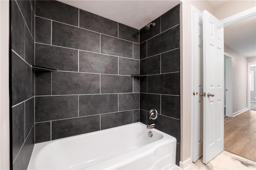 4786 Doyle Road Pittsburgh, PA 15227 - Photo 22 of 31 a bathroom with a bathtub