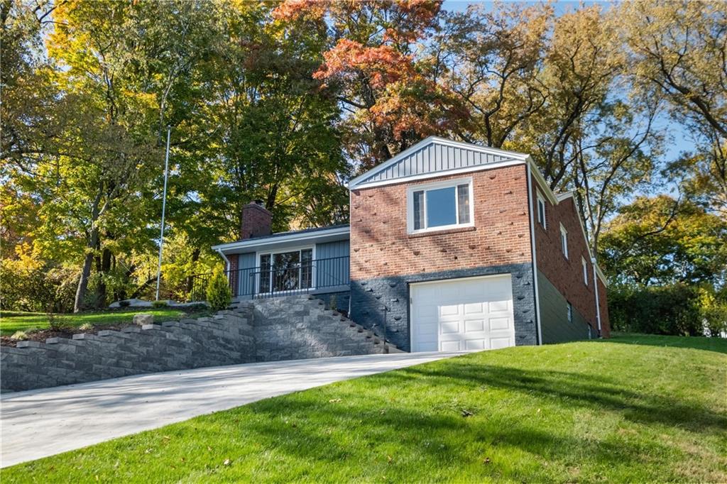 4786 Doyle Road Pittsburgh, PA 15227 - Photo 3 of 31 a front view of a house with a yard and garage