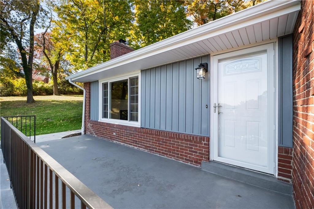 4786 Doyle Road Pittsburgh, PA 15227 - Photo 4 of 31 a view of a backyard with wooden fence and large trees