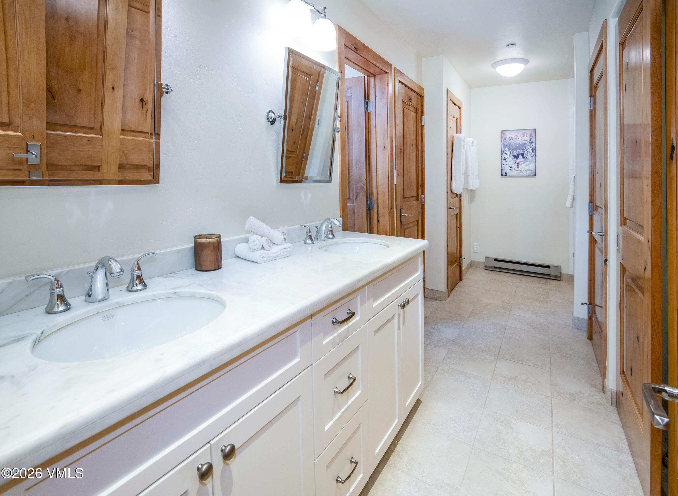 1206 Village Road, Unit B307 Beaver Creek, CO 81620 - Photo 11 of 20 a bathroom with double vanity sink and a mirror