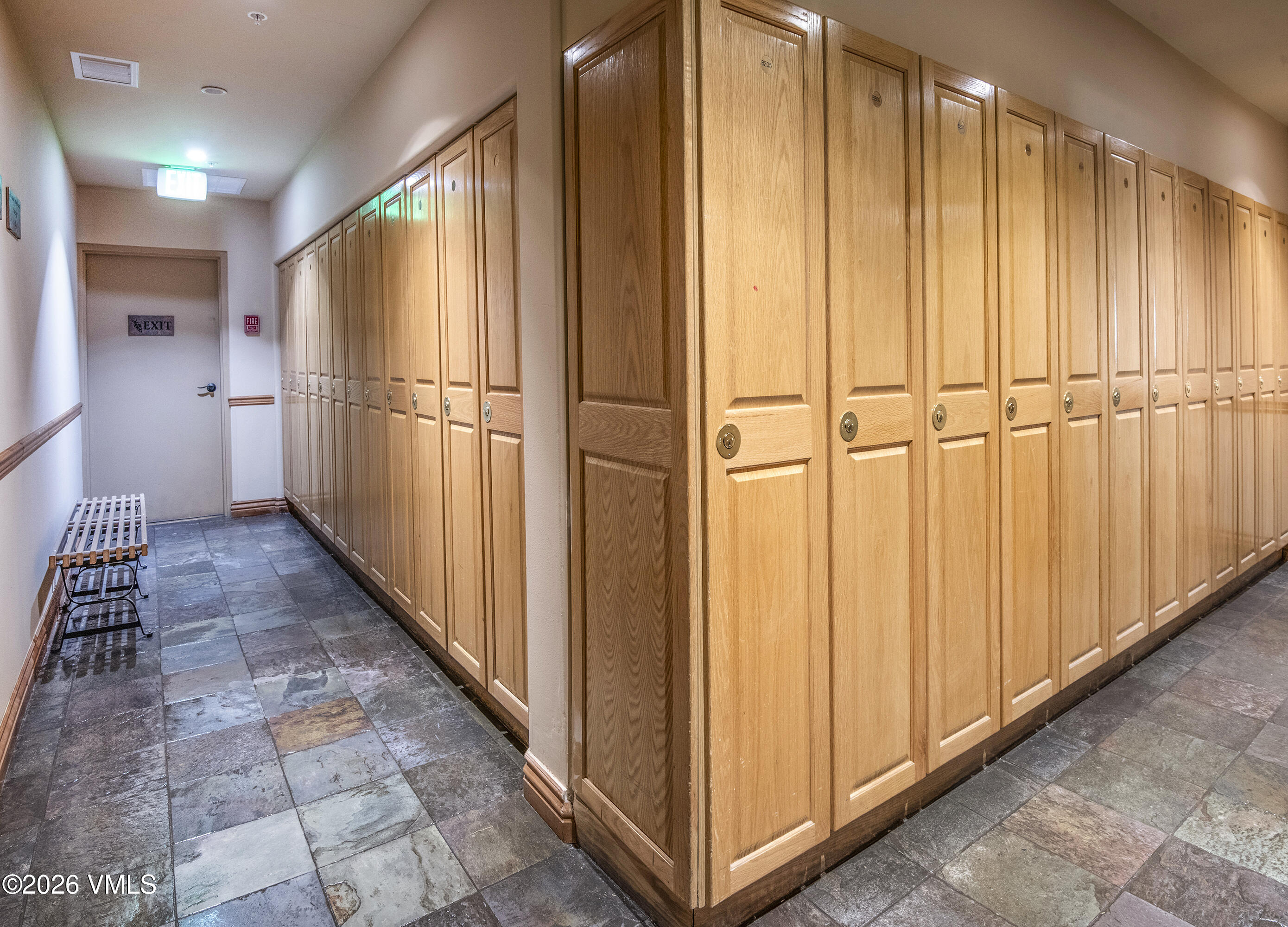 1206 Village Road, Unit B307 Beaver Creek, CO 81620 - Photo 18 of 20 a view of a hallway with wooden cabinets