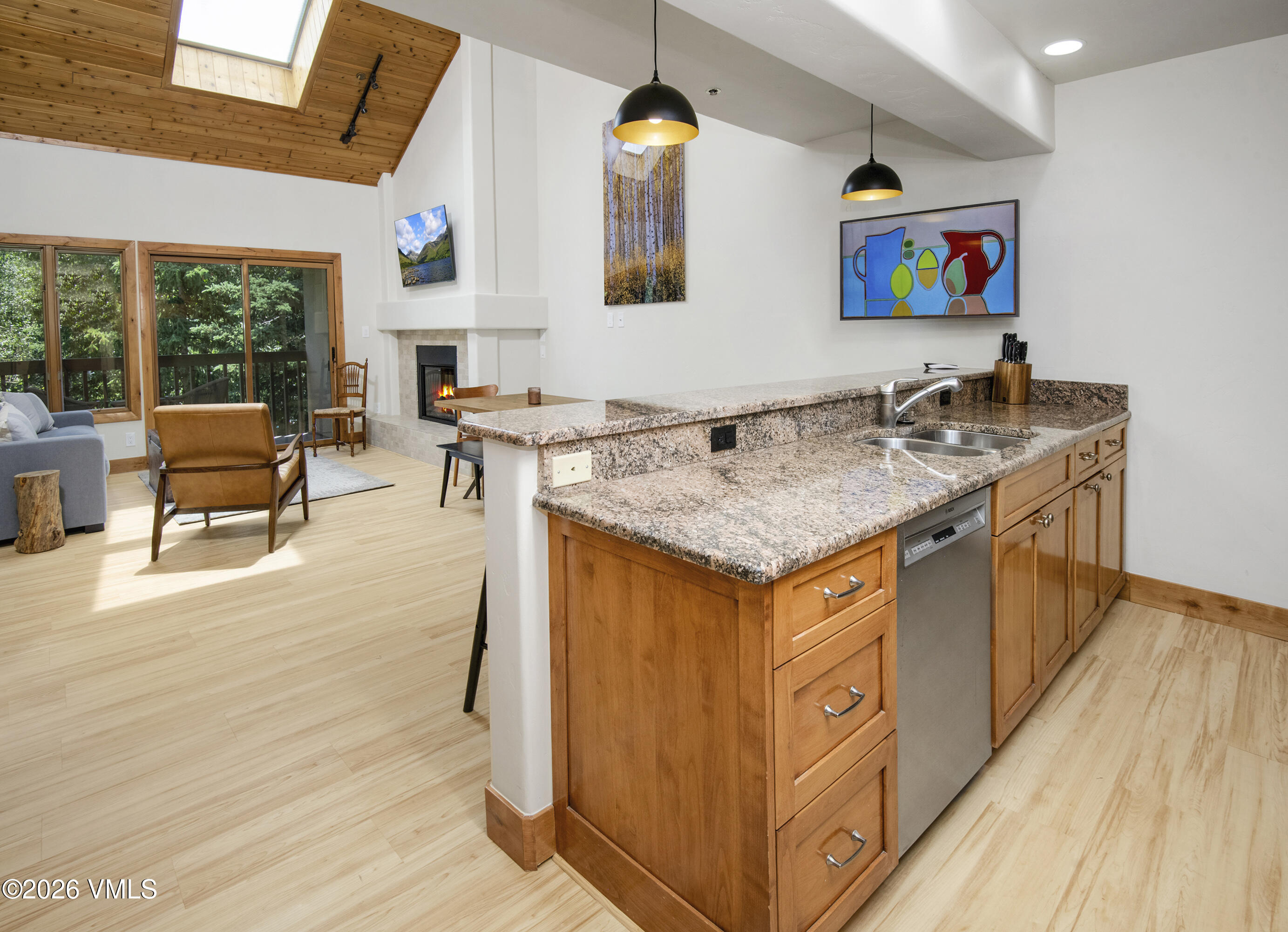 1206 Village Road, Unit B307 Beaver Creek, CO 81620 - Photo 3 of 20 a view of kitchen island with stainless steel appliances granite countertop sink and wooden floor