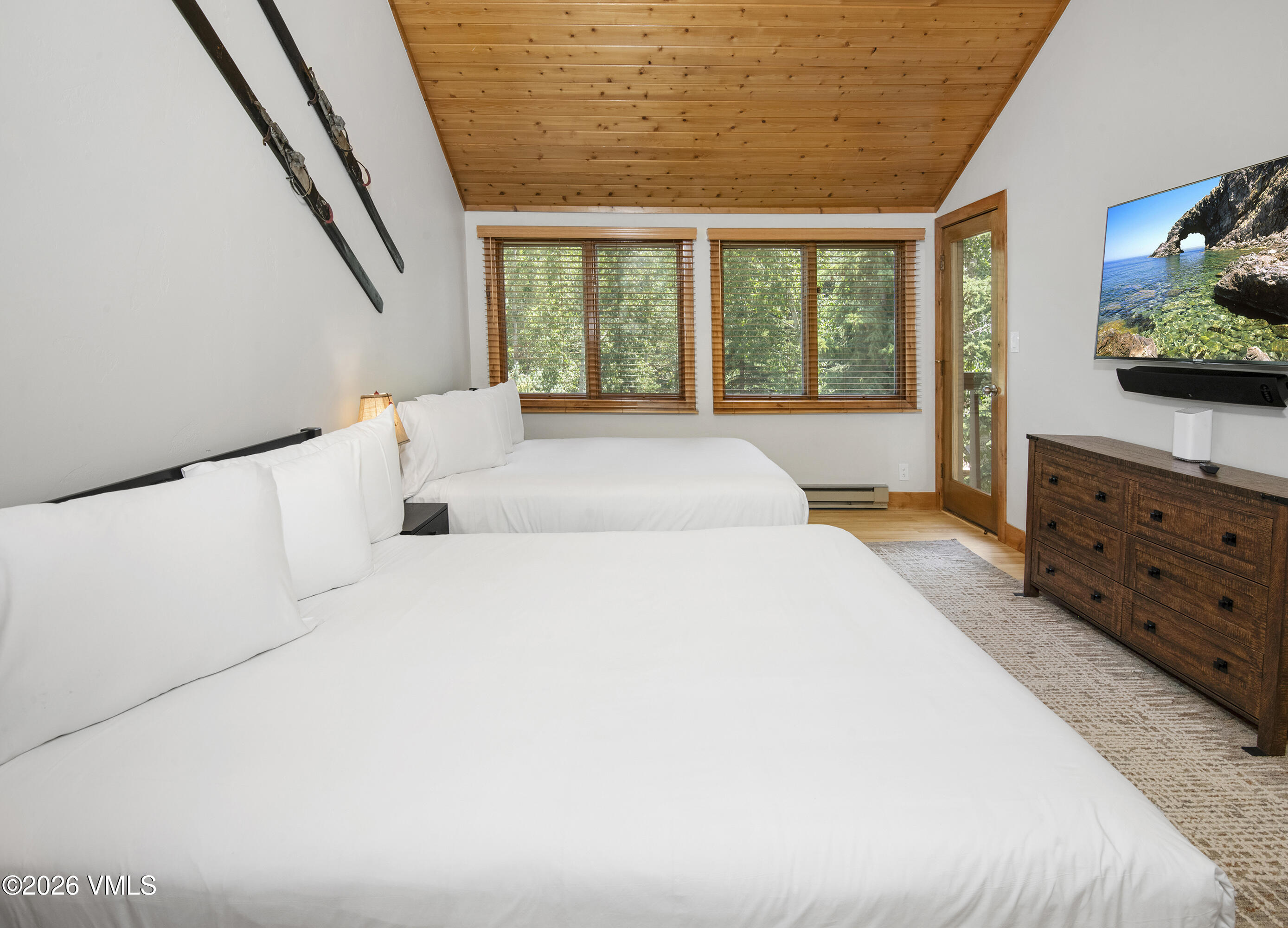 1206 Village Road, Unit B307 Beaver Creek, CO 81620 - Photo 9 of 20 a large white bed in a bedroom next to a window