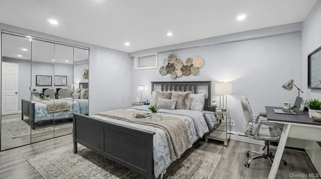 a bedroom with a bed and a couch