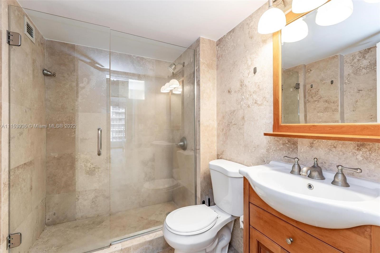 200 Southeast 15th Road, Unit 11H Miami, FL 33129 - Photo 17 of 20 a bathroom with a sink toilet and shower