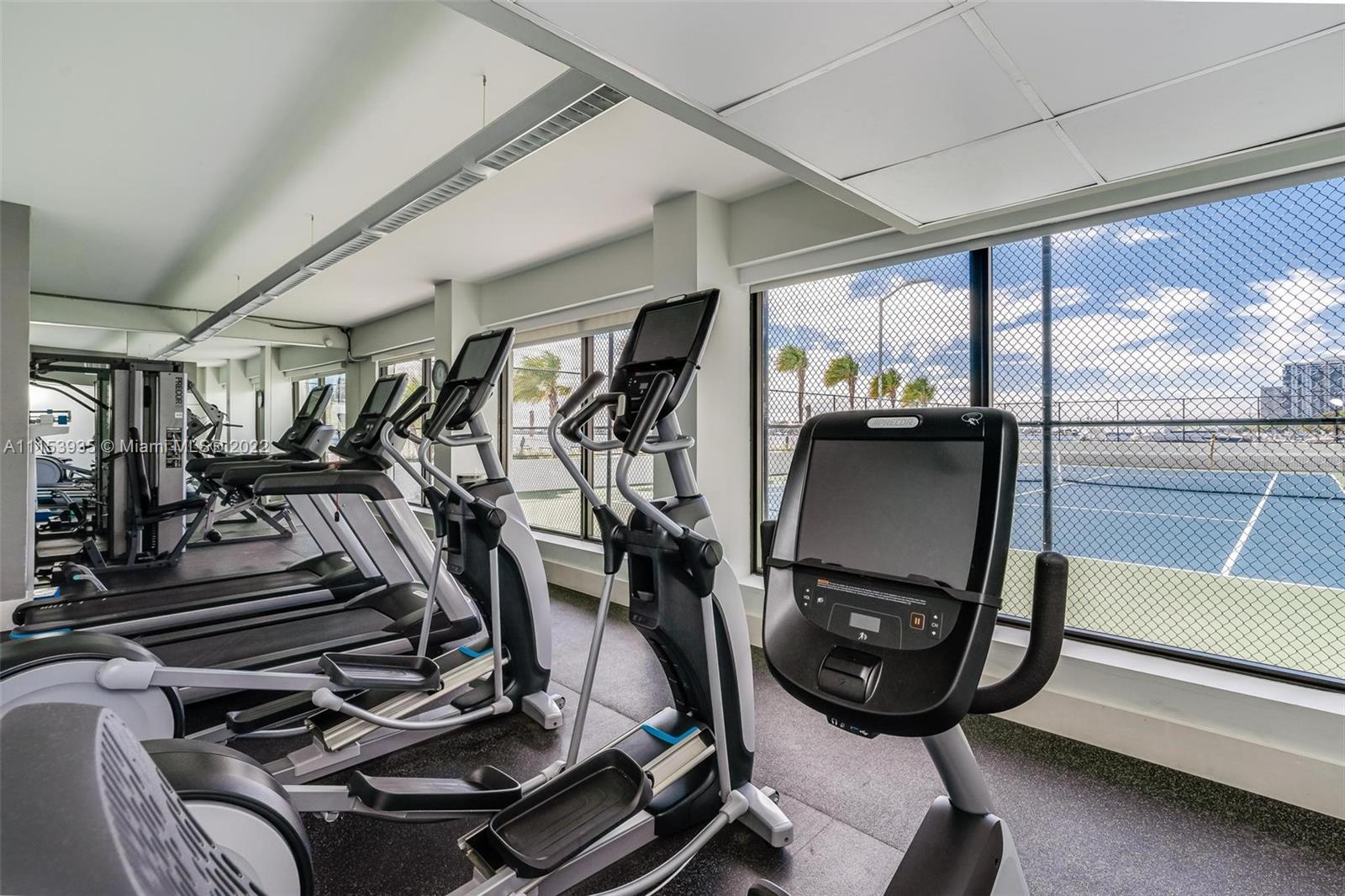 200 Southeast 15th Road, Unit 11H Miami, FL 33129 - Photo 6 of 20 a view of a room with gym equipment