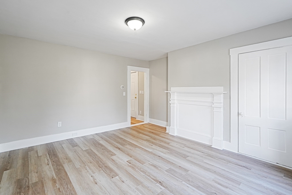 72 Main Street Pepperell, MA 01463 - Photo 7 of 26 a view of an empty room with wooden floor