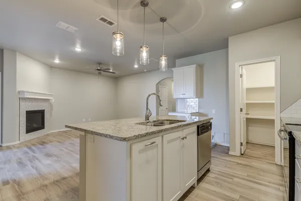 a view of a kitchen with a sink and dishwasher